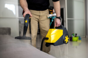 Man performing professional home cleaning service in San Antonio, TX by Alamo Steam Team