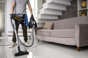 Man performing professional home cleaning service in San Antonio, TX by Alamo Steam Team